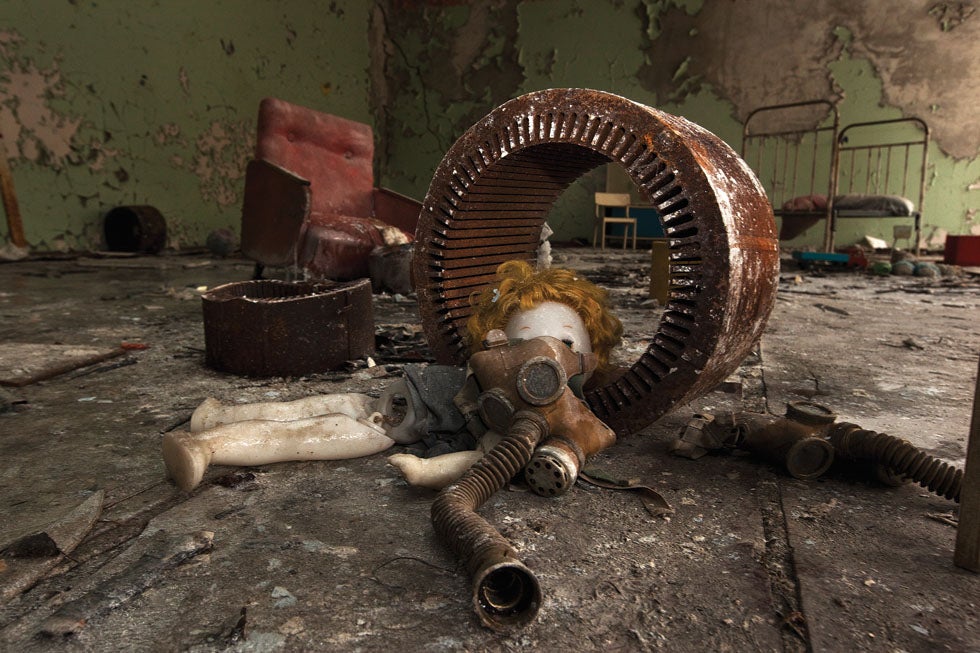 Toys and gas masks, likely arranged by a tourist, have become a standard motif; Pripyat, 2011.