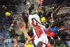 Rescue workers carry a garment worker, who was pulled alive from the rubble of the collapsed Rana Plaza garment building, in Savar, Bangladesh.