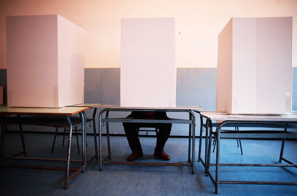 A Bosnian man casts a ballot at a voting booth in Potocari, Bosnia. Dado Ruvic is a general news photographer for Reuters, based in Bosnia. See more of his work on his <a href="http://dadoruvic.blogspot.com/">site</a>.