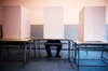 A Bosnian man casts a ballot at a voting booth in Potocari, Bosnia. Dado Ruvic is a general news photographer for Reuters, based in Bosnia. See more of his work on his <a href="http://dadoruvic.blogspot.com/">site</a>.