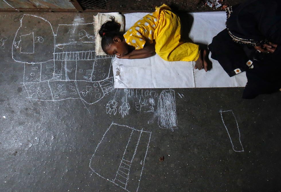 Noor Jahan, 5, sleeps on chalk drawings she made as her mother begs for alms at a railway station in Mumbai. Danish Siddiqui is a Reuters staffer based in India. You can keep up with his work by following his <a href="http://blogs.reuters.com/danish-siddiqui/">Reuters blog</a> and his <a href="https://twitter.com/dansiddiqui">Twitter</a>.