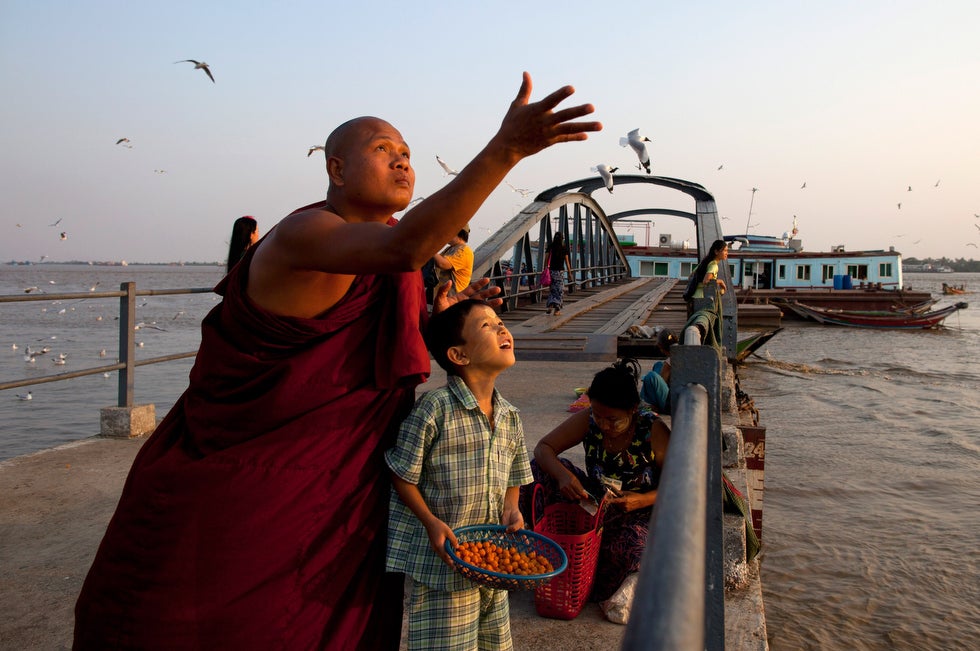 A monk and his son feed seagulls in Yangon, Myanmar the day before a historic parliamentary election. The election is seen as an important vote of confidence for the country as it continues on the road to political and diplomatic reform. Paula Bronstein is a Getty Images staff photographer and a Pulitzer Prize finalist. You can see her incredible portfolio of work on <a href="http://www.reportagebygettyimages.com/paula-bronstein/#portfolio">Getty Images</a>.