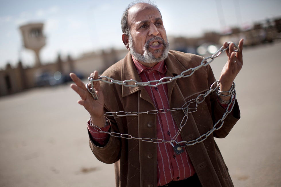 Getty Images stringer <a href="http://www.carsten-koall.com/">Cartsen Koall</a> captured this image of an unidentified Egyptian protestor, holding up chains, symbolic of the regime of ousted president, Hosni Mubarak. Mubarak currently stands trial for the killing of hundreds of demonstrators. Koall's incredible work in Egypt has appeared in our last two <a href="http://www.americanphotomag.com/tags/photojournalism-week">Images of the Week</a> galleries.