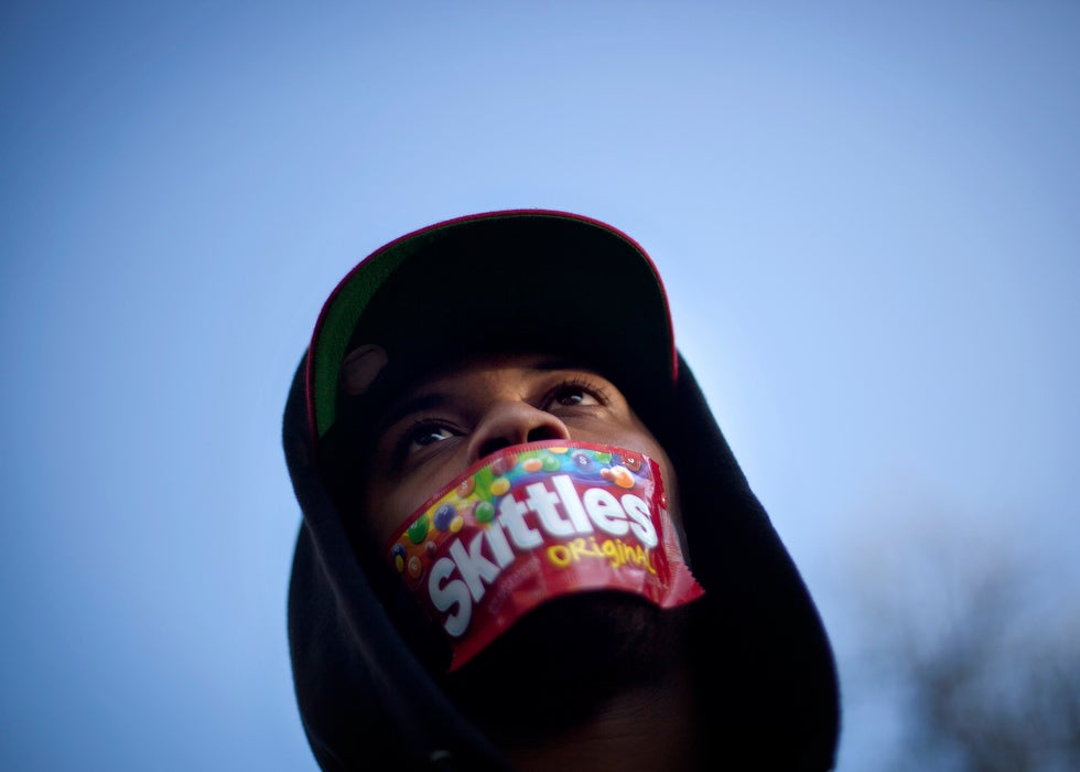 Jajuan Kelley, of Atlanta, wears a Skittles wrapper over his mouth during a rally in memory of Trayvon Martin, the unarmed 17-year-old who was killed by a Florida neighborhood watch captain while returning from a convenience store with a bag of Skittles. David Goldman is a staff photographer for the Associated Press based in Atlanta. You can see more of his work on his <a href="http://www.goldmanphotos.com/">personal site</a>.