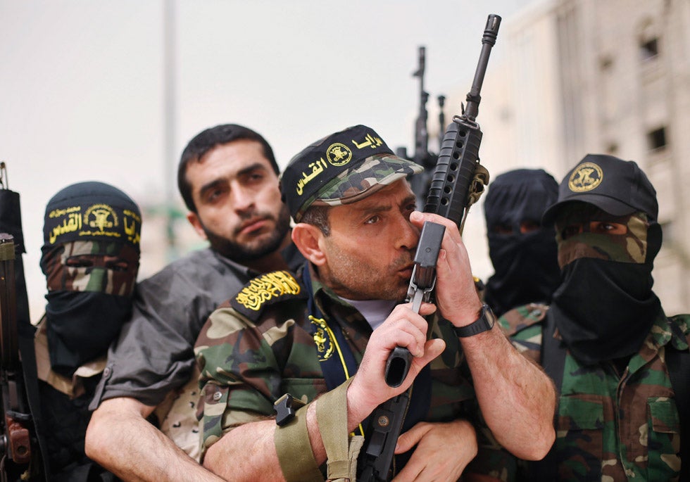 Freed Palestinian prisoner Ibrahim Baroud kisses a gun as enters the northern Gaza Strip surrounded by Islamic Jihad militants. He had spent 27 years in Israeli jail. Mohammed Salem is a Reuters photographer based in Palestine. See more of his work in our <a href="http://www.americanphotomag.com/photo-gallery/2012/11/photojournalism-week-november-30?page=4">past round-up</a>.