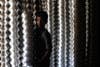 A boy poses in an aluminum pot-making factory, where he works, in Dhanka, Bangladesh. UNICEF estimates that somewhere around 6.3 million children under 14 are currently working in Bangladesh. Munir Uz Zaman is a freelance photographer, working for AFP in the Dhanka region.