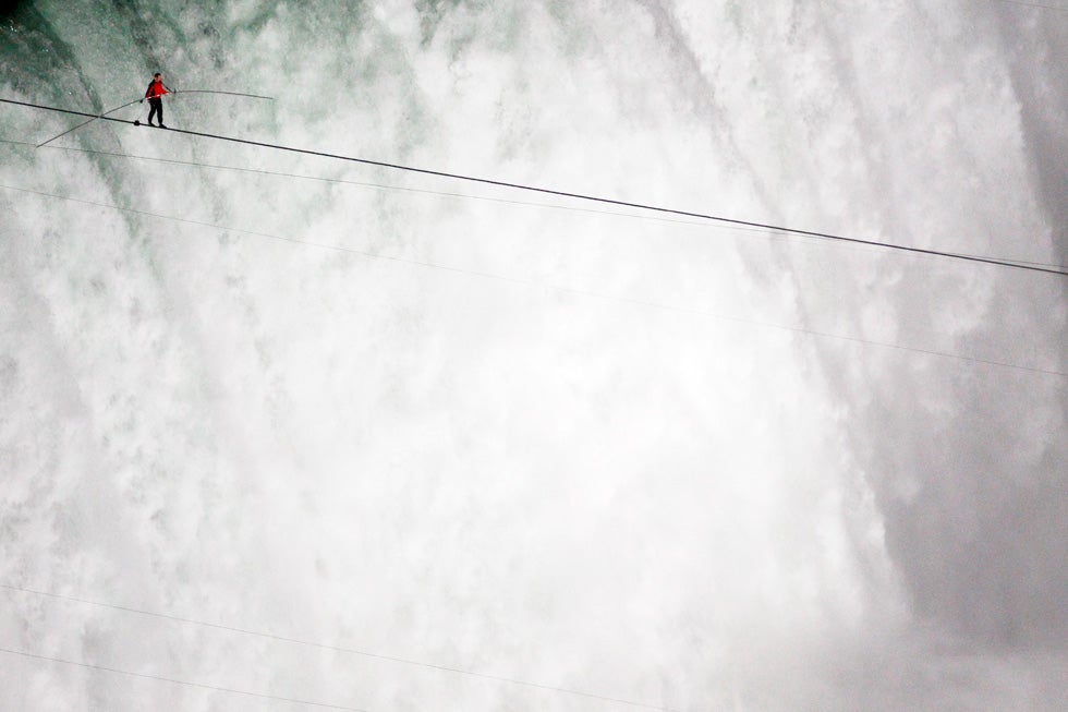 Tightrope walker Nik Wallenda successfully walks the high wire over Horseshoe Falls in Niagara Falls. Mark Blinch is a freelance photographer working for Reuters out of Ontario, Canada. See more of his work on his <a href="http://blog.markblinch.com/">personal blog</a>.