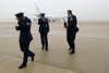 Three U.S. Air Force officers hold onto their hats as Air Force One departs from Joint Base Andrews, Maryland. Jonathan Ernst is a Reuters staff photographer based in Washing DC. Check out more of his incredible work on his <a href="http://www.jonathanernst.com/">personal site</a>.