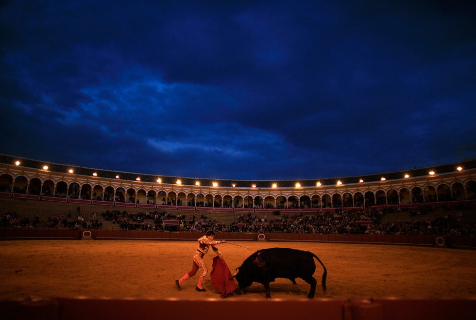 Spanish matador Eduardo Gallo drives a sword into a bull to kill it during a bullfight at The Maestranza bullring in the Andalusian capital of Seville, southern Spain. Marcelo del Pozo is a Reuters staffer based in Spain.