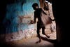 Sachin, 14, a child with a severe physical disorder affecting his bone structure and legs, is entering his home in the impoverished Oriya Basti Colony in Bhopal, Madhya Pradesh, near the abandoned Union Carbide (now DOW Chemical) industrial complex.