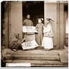 Manchu women buying flowers for their headdresses, Beijing, 1871–72.