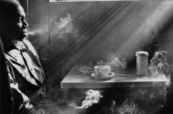 Man Smoking in 14th St Diner, NYC, 1974