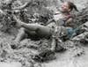 Tourists play in the mud during the opening day of the Boryeong Mud Festival at Daecheon beach in Boryeong, South Korea. Lee Jae Won has been Reuters' chief photographer for Korea since 2002. Check out more of his work on the <a href="http://blogs.reuters.com/jae-won-lee/">Reuters blog</a>. And if you like mud festivals, <a href="http://www.americanphotomag.com/photo-gallery/2012/02/street-photographs-heart-china">see also the work of ERIC</a> who we've recently featured.