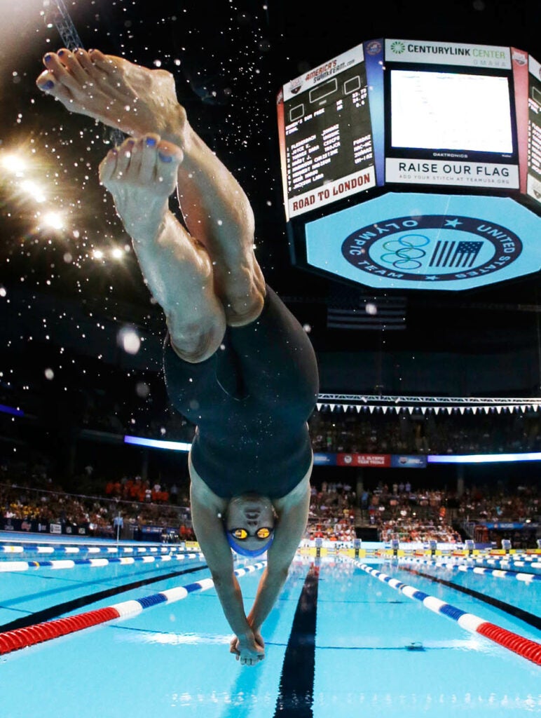 Swimmer Dara Torres dives at the start of the women's 50-meter freestyle final at the U.S. Olympic trials in Omaha, Nebraska. Mark Humphrey is a US-based sports photographer for the Associated Press.