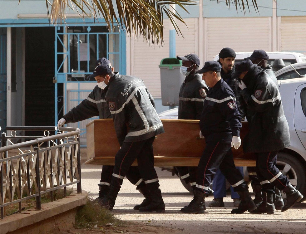 Rescue workers deliver a coffin containing the body of one of the hostages killed during a four-day siege at an Algerian gas plant to a local hospital. The hostage death toll has risen to almost 60 in an attack claimed by veteran Islamists fighter on behalf of al Qaeda. Ramzi Boudina is a stringer working for Reuters in Algeria.