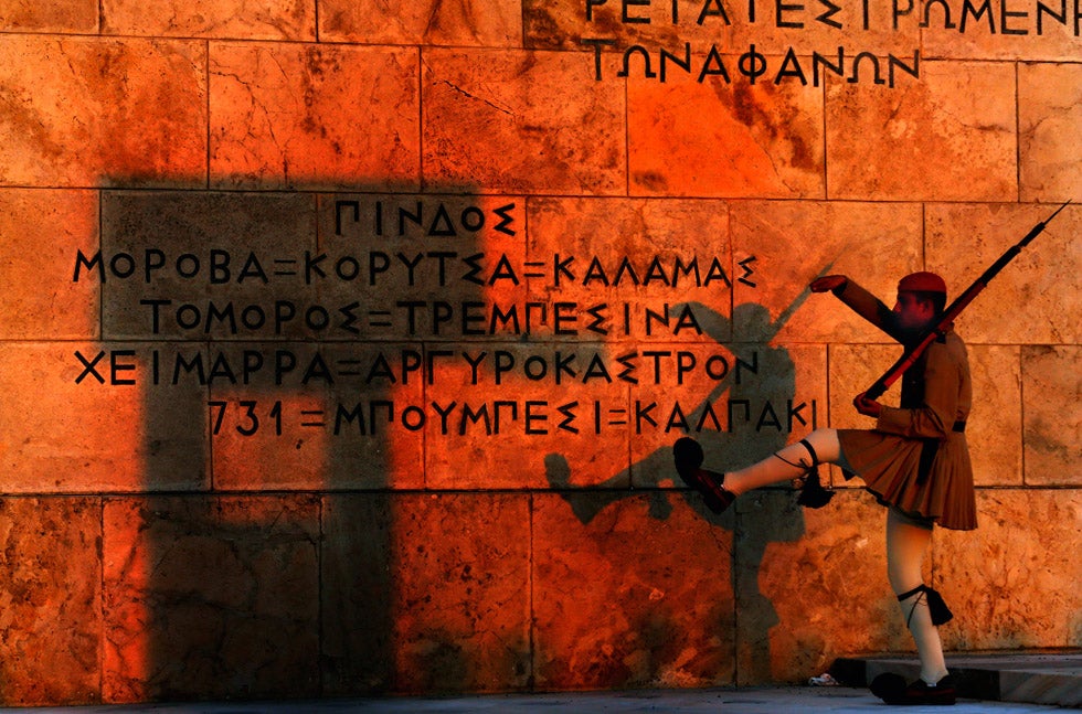 A Greek presidential guard marches past the Memorial of the Unknown Soldier in Athens. Yannis Behrakis who was previously Reuters' chief photographer for the Israeli and Palestinian territories, has been shooting in Athens since 2002. He has been with Reuters since 1987. In 2000, he was wounded while on assignment in Sierra Leone in an ambush. He claims the only reason he was able to get away from the attackers and survive was thanks to "hostile-environment training" he had done five years earlier. You can keep up with his assignments by following his <a href="http://blogs.reuters.com/yannis-behrakis/">blog</a>.