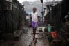 A child stands in pouring rain in the slum of Susan's Bay in Sierra Leone's capital of Freetown. Sierra Leone's government has described the current cholera outbreak in the West African state as a "national emergency." At the height of the wet season, over-populated areas with poor water and sanitation are exacerbating the spread of the disease. Simon Akam is a freelance photo correspondent for Reuters based in Sierra Leone. His career has brought him to some of the furthest reaches of the planet—see his incredible portfolio on his <a href="http://www.simonakam.com/">personal site</a>.