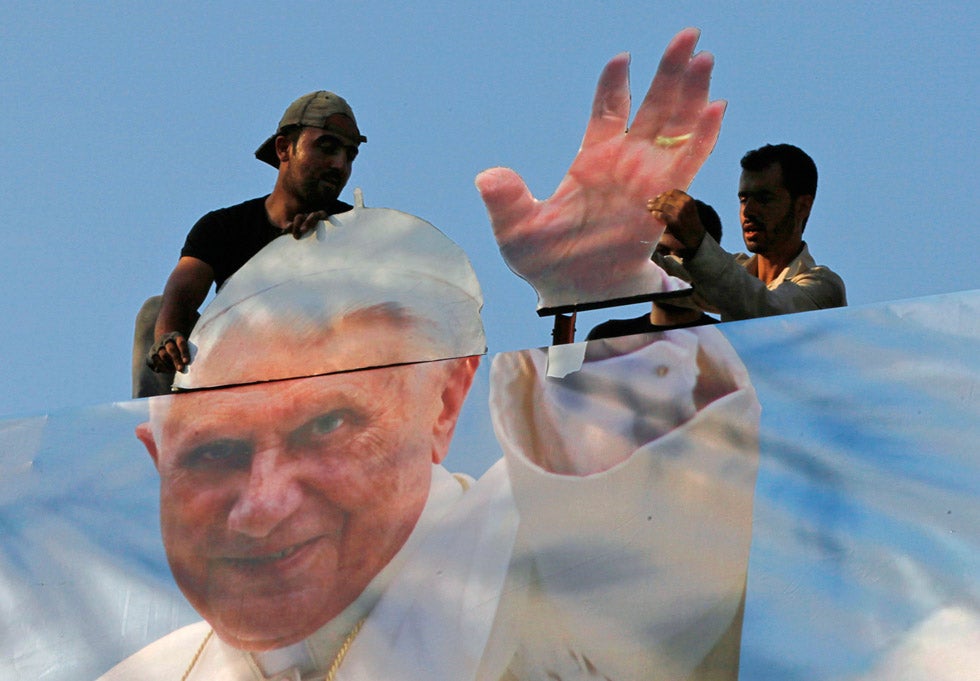 Workers hang a poster of Pope Benedict XVI in preparation for his arrival for a three-day visit to Lebanon. Jamal Saidi is Reuters’ chief photographer to Lebanon.