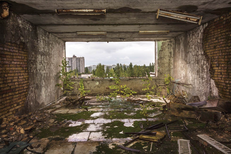 Above: Inside an abandoned building, Pripyat, Ukraine, 2013. The city was evacuated 36 hours after the Chernobyl accident; residents were allowed to take only vital documents and belongings. Today the buildings are pilfered by looters and nature is reclaiming empty spaces.
