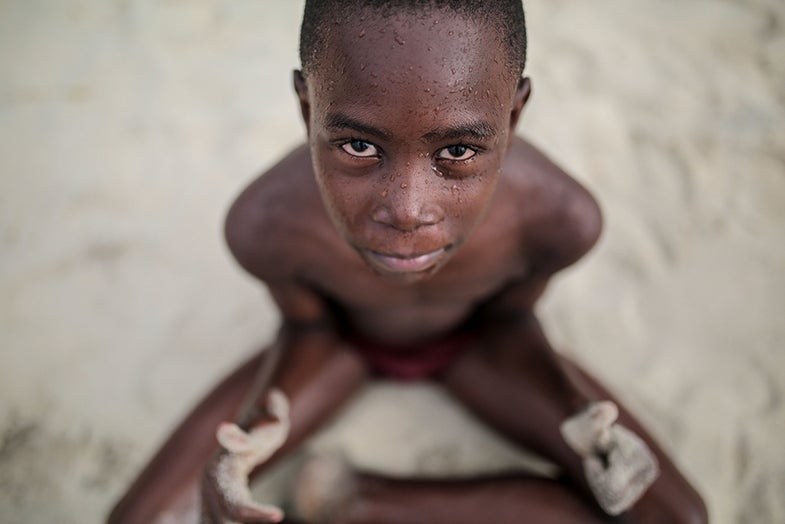 A Zanzibari child poses for the camera after a swim in the Indian Ocean in Zanzibar, Tanzania, on Tuesday, Jan. 20, 2015. (AP Photo/Mosa'ab Elshamy)