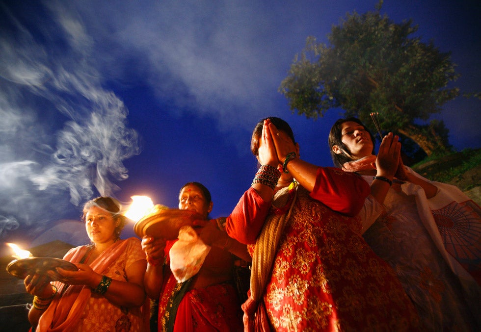 Hindu devotees offer prayers at the Pashupatinath temple as they take part in the "Bol Bom" pilgrimage in Kathmandu, Nepal. The faithful, chanting the name of Lord Shiva, run nine miles barefoot to Pashupatinath temple seeking good health, wealth and happiness. Navesh Chitrakar is a Reuters staffer based in Nepal. This is one of two images Chitrakar has featured in this week's round up. Check out the other later in the gallery and see more of his work on the <a href="http://in.reuters.com/news/pictures/slideshow?articleId=INRTR2TSMC">Reuters blog</a>.