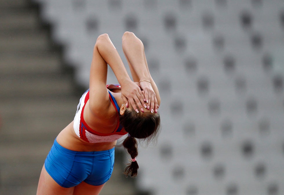 Mariya Kuchina of Russia reacts after finishing third and getting the bronze medal in the High Jump final at the IAAF World Junior Championships in Barcelona, Spain. Gustau Nacarino is a veteran photojournalist working for Reuters out of Barcelona, Spain.