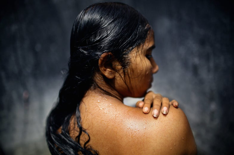 Beauty showers three times a day in between servicing clients. She is one of the underage minority in the area educated in the risks to her sexual health of working in Sonagachi. Nonetheless she regularly attends four to five clients in between every shower.