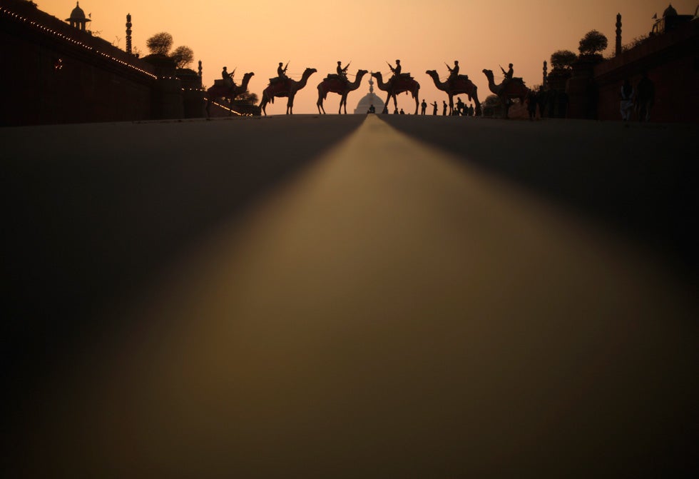 India's Border Security Force soldiers ride their camels in front of India's presidential palace Rashtrapati Bhavan during a rehearsal for the "Beating the Retreat" ceremony in New Delhi. Adnan Abidi is a Reuters staffer who has been with the agency for seven years. He is currently based in New Delhi. See more of his work in our past <a href="https://www.americanphotomag.com/photo-gallery/2012/09/photojournalism-week-september-14-2012?page=1">round-up</a>.