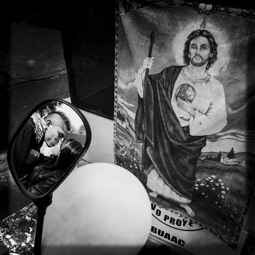 Mexico City, Mexico:  
A couple seen through the rearview mirror of their bicitaxi, in front of an image of Saint Jude Thaddeus, 'The Saint for the Hopeless and the Despaired'.

Photo © Adriana Zehbrauskas @adrianazehbrauskas #mexicocity #mexico #DF  #photography #documentary

https://instagram.com/p/zBq_YwN5Kv/?taken-by=adrianazehbrauskas 