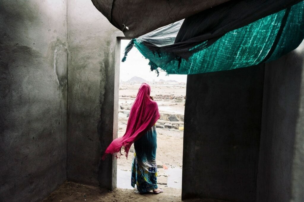 woman in pink head covering in Yemen