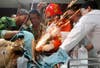 Doctors and firefighters work together to cut steel bars from a worker's body during an operation at a hospital in Hangzhou, Zhejiang province of China. A total of seven bars pierced the worker during his duty at a bridge construction site.