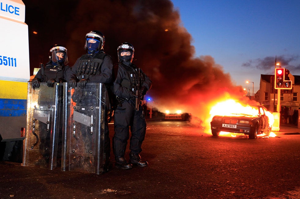 Police officers in riot gear stand near a burning hijacked car during rioting in East Belfast. Violent protests continue in Northern Ireland as loyalists renewed their anger against restrictions on flying the union flag from Belfast City Hall. Cathal McNaughton is an Irish-based photographer working for Reuters. Before working with Reuters he started his career with the Irish News in Belfast. See more of his work on his <a href="http://cathalmcnaughton.com/">site</a>. Also check out his image from last week's round-up <a href="http://www.americanphotomag.com/photo-gallery/2013/01/photojournalism-week-january-11-2013?page=2">here</a>.