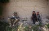 Afghan boys look at a U.S. Army soldier in Zharay district of Kandahar province in Afghanistan. Shamil Zhumatov is a Reuters staffer currently covering the ongoing conflict and US troop withdrawal in Afghanistan.