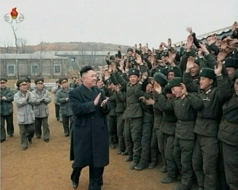 North Korean leader Kim Jong-un (front on L) applauds as he is welcomed by members of the military at an undisclosed location, in this still image taken from video shown by North Korea's state-run television KRT on March 8, 2013. North Korea threatened the U.S. on March 7, 2013, with a preemptive nuclear strike, raising the level of rhetoric while the U.N. Security Council considers new sanctions against the reclusive country. REUTERS/KRT via Reuters TV (NORTH KOREA - Tags: POLITICS MILITARY TPX IMAGES OF THE DAY) ATTENTION EDITORS � THIS IMAGE WAS PROVIDED BY A THIRD PARTY NORTH KOREA OUT. NO COMMERCIAL OR EDITORIAL SALES IN NORTH KOREA. THIS PICTURE IS DISTRIBUTED EXACTLY AS RECEIVED BY REUTERS, AS A SERVICE TO CLIENTS. FOR EDITORIAL USE ONLY. NOT FOR SALE FOR MARKETING OR ADVERTISING CAMPAIGNS. THIS IMAGE HAS BEEN SUPPLIED BY A THIRD PARTY. IT IS DISTRIBUTED, EXACTLY AS RECEIVED BY REUTERS, AS A SERVICE TO CLIENTS. NORTH KOREA OUT. NO COMMERCIAL OR EDITORIAL SALES IN NORTH KOREA - RTR3EPOY