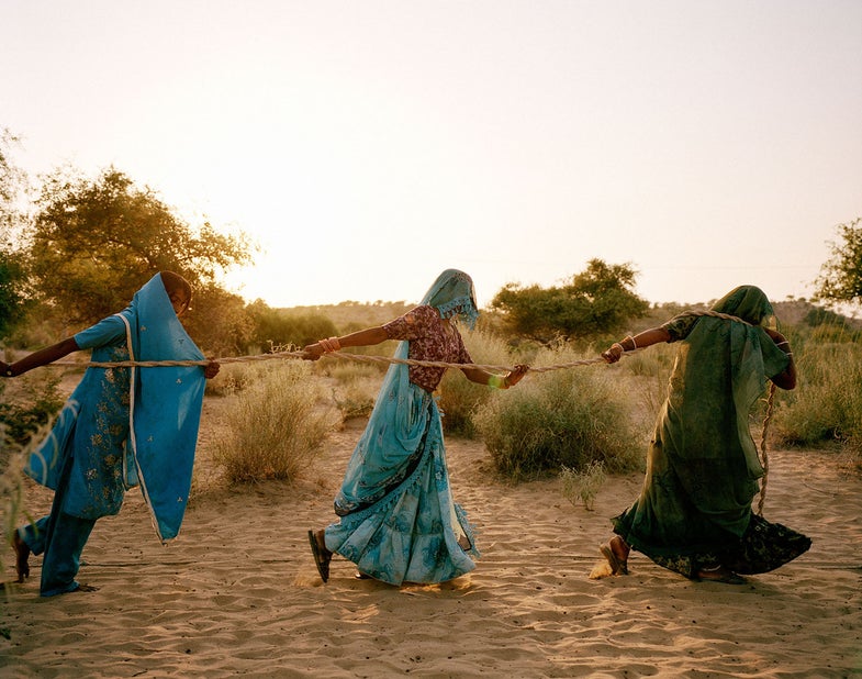 Syngenta Photography Award: Professional Commission Caption: Women pull well water together Photographer: Mustafah Abdulaziz Email: abdulaziz.mustafah@gmail.com Address: 58 Metropolitan Avenue, #4C, Brooklyn, New York, 11249, Uganda Location: Tharpakar, Pakistan Taken at: 2013-09-24 Medium: Medium format color film Size: 6x7 Additional information: Women of Tharpakar in the southern Sindh Province of Pakistan work together to pull water from a well. Even when one person is done, they all remain at the well to share in the task. One of the effects of the flooding was salinity in the ground, which affected the ability for the agricultural region to support itself. The water gathered is brackish and dangerous to the health of children, who often suffer diarrhea and other water-borne illnesses.