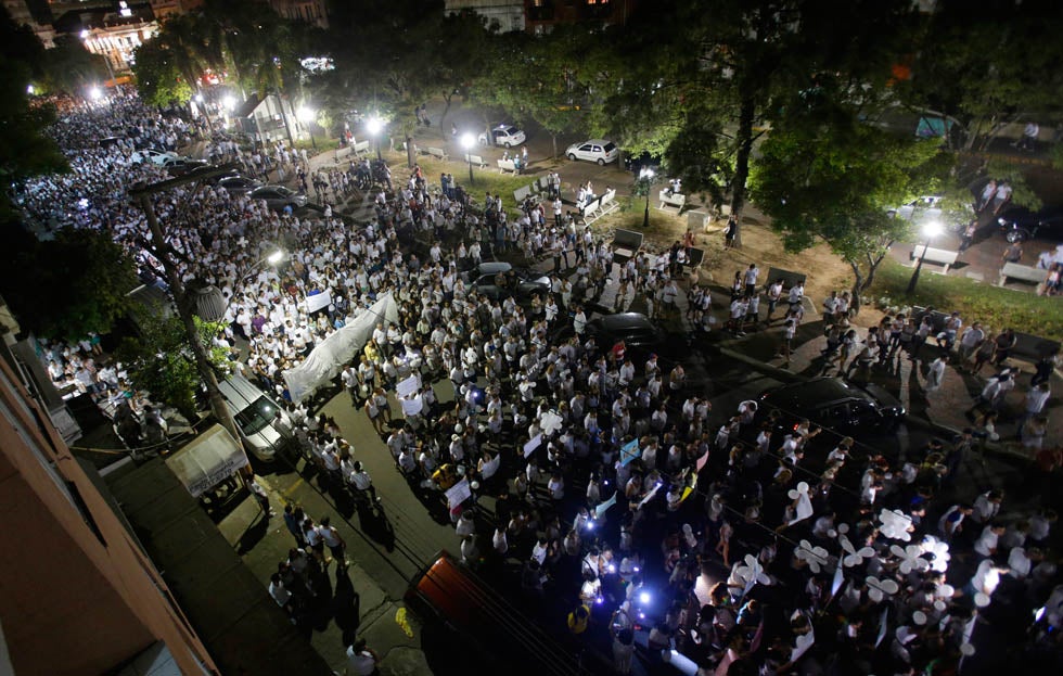 People march in tribute to the victims of the Kiss nightclub fire in the southern city of Santa Maria, Brazil. Ricardo Moraes is a full-time stringer working for Reuters in Rio de Janeiro. He started he career in photography at the age of 14 as a studio assistant. See more of his work <a href="http://www.americanphotomag.com/photo-gallery/2013/01/photojournalism-week-january-4-2013?page=7">here</a>.