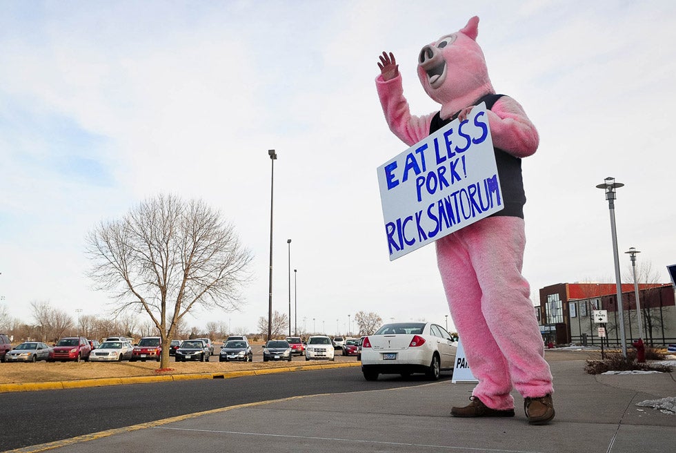 A protestor stands outside a campaign event for presidential nominee hopeful and former Senator Rick Santorum prior to caucuses in Colorado, Minnesota and Missouri. Santorum would go on to win all three. This image was captured by Minnesota-based Getty Images stringer <a href="http://www.bengarvin.com/#">Ben Garvin</a>, a full-time staff photographer for the Pioneer Press in St. Paul, Minnesota.