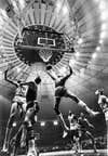 Wilt Chamberlin of the 76ers going up for a layup during a Knicks game at Madison Square Garden, seen in the back ground #19 Willis Reed of the Knicks, 1968