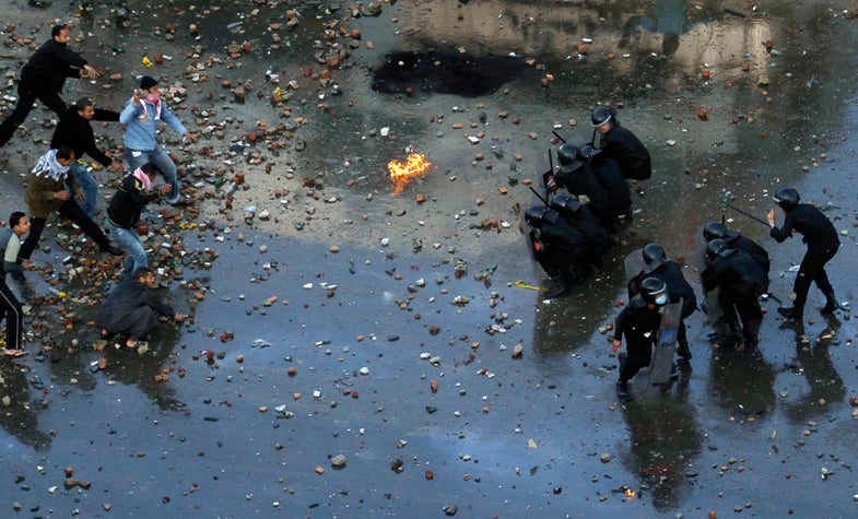 Egyptian anti-government protesters clash with riot police at the port city of Suez, about 134 km (83 miles) east of Cairo, January 27, 2011. Police fired rubber bullets, water cannon and tear gas at hundreds of demonstrators in the eastern city of Suez, on a third day of protests calling for an end to President Hosni Mubarak's 30 year-old-rule. REUTERS/Mohamed Abd El-Ghany (EGYPT - Tags: CIVIL UNREST POLITICS IMAGES OF THE DAY) - RTXX5RW