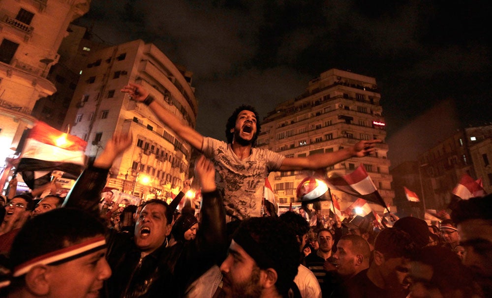 Anti-government protesters celebrate inside Tahrir Square after the announcement of Egyptian President Hosni Mubarak's resignation in Cairo February 11, 2011. A furious wave of protest finally swept Mubarak from power on Friday after 30 years of one-man rule, sparking jubilation on the streets and sending a warning to autocrats across the Arab world and beyond. Dylan Martinez is a Reuters staffer currently based in the UK. **WARNING: THE NEXT PHOTO IS GRAPHIC IN NATURE. **