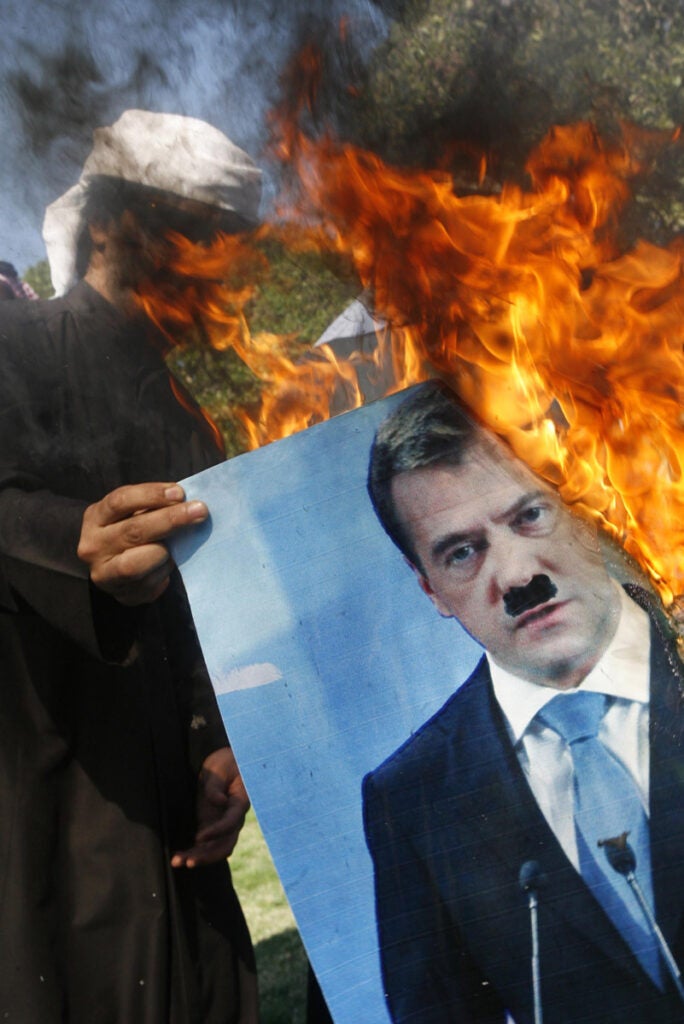Yasser al-Zayyat, a stringer for AFP and Getty Images, made this image of a protestor burning a portrait of Russian President Dmitry Medvedev in Kuwait City outside of the Russian embassy. This week, Russia vetoed a U.N. Security Council resolution condemning the government's deadly crackdown in Syria, drawing protests in countries across Europe and the Middle East. See more of Yasser al-Zayyat's work on the AFP photographer <a href="http://portfolios.afp.com/photographers/region/middle-east/yasser-al-zayyat.html">portfolio site</a> and on the <em>New York Times</em> <a href="http://lens.blogs.nytimes.com/tag/yasser-al-zayyat/">Lens blog</a>.