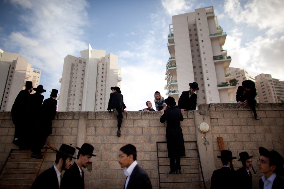 Photographer Uriel Sinai captured this image of ultra-Orthodox Jews attending the funeral of Rabbi Moshe Yehoshua Hager in Bei Brak, Isreal. Hager, who died at the age of 95-years-old, was the head of Israel's second largest Hasidic community. Sinai, who is a stringer for Getty, recently won first prize in the annual World Press Photo contest for his work in the region. You can see more of Sinai's images on his <a href="http://urielsinai.com/#/photography/war-in-georgia/gori_001">Website</a>.