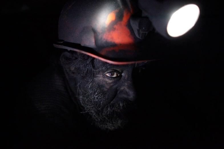 A miner takes a short break inside an unregulated coal mine in Sabinas January 15, 2013. Everyday, thousands of miners go to work in the unregulated coals mines of northern Mexico knowing they may not return. Facing death on a daily basis has become a fact of life for these men as they struggle to scrape out a living in an environment bereft of rules and regulations, lacking even the most basic equipment. Unregulated mines are legal in Mexico. A company buys or leases land from a cooperative and is legally allowed to mine on it, but is not subject to any regulations. Despite the dangers, some 30,000 miners find themselves willing to take the risk, approaching their job with a matter-of-fact philosophy. Picture taken January 15, 2013. REUTERS/Daniel Becerril (MEXICO - Tags: ENERGY BUSINESS EMPLOYMENT COMMODITIES TPX IMAGES OF THE DAY) - RTR3D8ZG