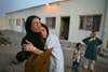 Mejgon, 16, weeps in the arms of her caseworker near fellow residents at an NGO shelter run by Afghan women in Herat, Afghanistan. Mejgonís father sold her at the age of 11 to a 60-year-old man for two boxes of heroin.