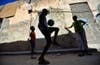Boys juggle a football in front of their house in Benghazi, Libya. Esam Al-Fetori is a fulltime photographer based in Libya and shooting for Reuters.