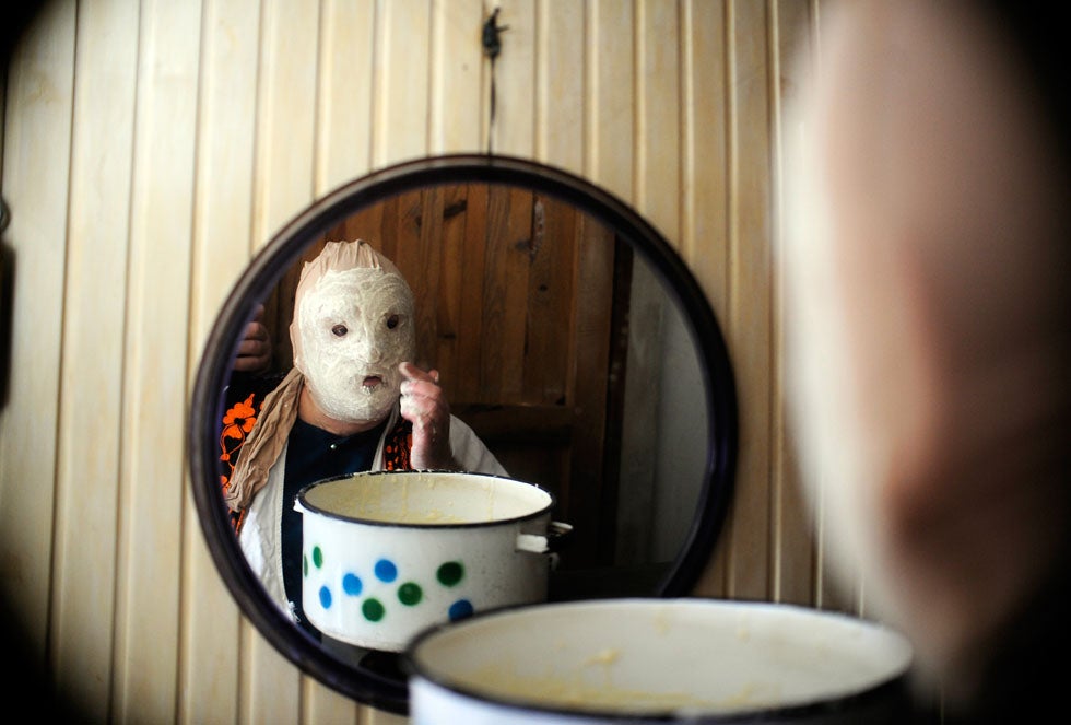 A reveller applies a mask before parading the streets during a carnival in the village of Vevcan, Macedonia. Ognen Teofilovski is a Macedonia-based photojournalist working for Reuters. See more of his work <a href="http://www.americanphotomag.com/photo-gallery/2012/08/photojournalism-week-august-10-2012?page=8">here</a>.