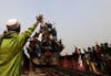 An overcrowded train crosses a bridge after the final Muslim prayer ceremony of Bishwa Ijtema in Tongi, on the outskirts of Dhaka, Bangladesh. Andrew Biraj is a Reuters staff photographer based out of Dhaka, Bangladesh and the winner of a 2011 World Press Photo award. According to his <a href="http://www.lightstalkers.org/andrew_biraj">Lightstalker page</a>, "he often focuses on the people living on the fringe from the social, political and environmental perspectives," in the region. Check out his past photos in our <a href="http://www.americanphotomag.com/photo-gallery/2012/10/photojournalism-week-october-5-2012?page=7">round-up</a>.