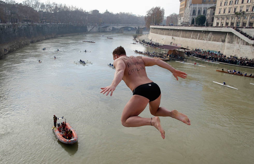 An unidentified man dives into the Tiber River from the Cavour bridge, as part of traditional New Year celebrations in Italy. Tony Gentile is a Reuters staffer based in Europe. See more of his work <a href="http://www.americanphotomag.com/photo-gallery/2012/06/photojournalism-week-june-29-2012?page=6">here</a>.