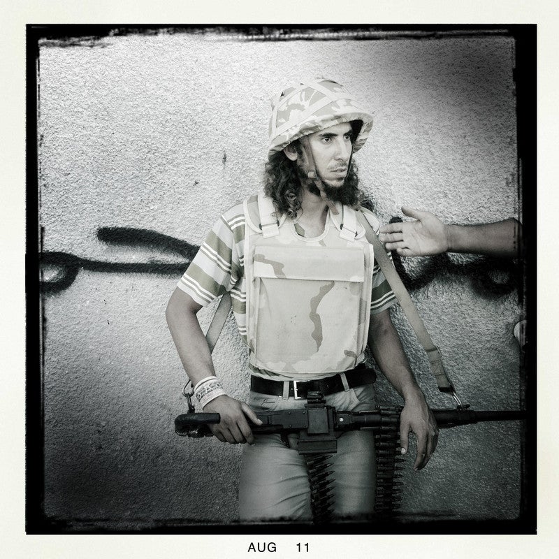 A rebel fighter is seen as rebels move into a pro-Qaddafi area, Tripoli, Libya, Aug. 25, 2011.