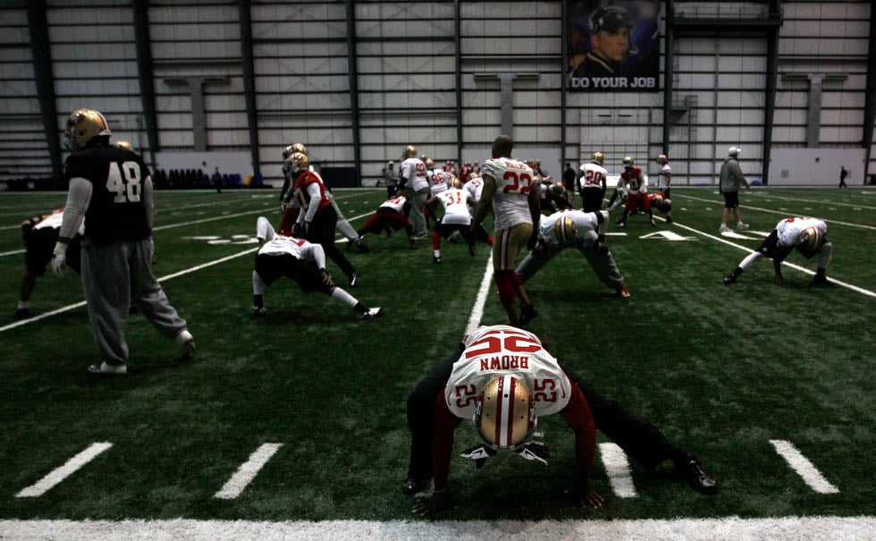 San Francisco 49ers cornerback Tarell Brown (25) stretches with the rest of his team before practice for the Super Bowl in New Orleans. Jeff Haynes is a sports and general news photographer for Reuters.